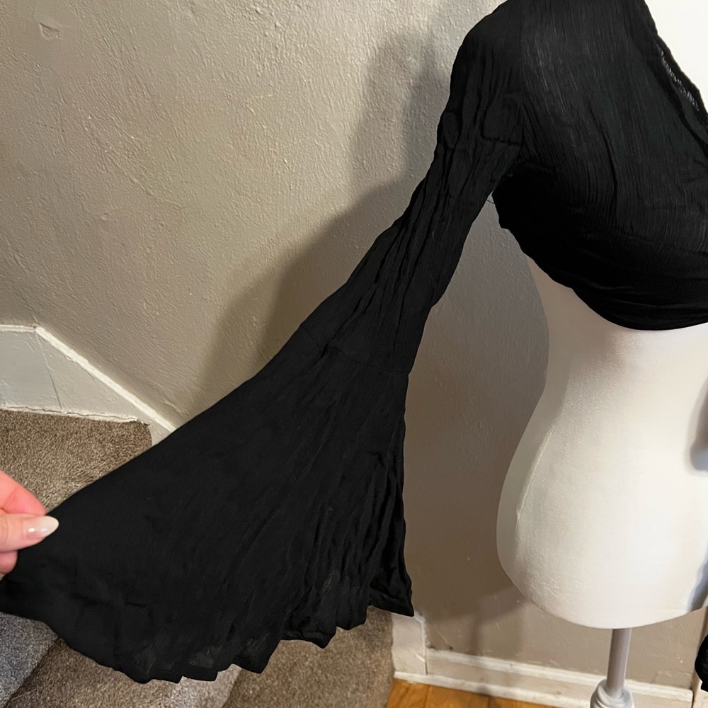 Long, bell sleeved crop top